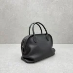 The Row Agnes Bowling Bag in Black or Dark Brown - Image 2