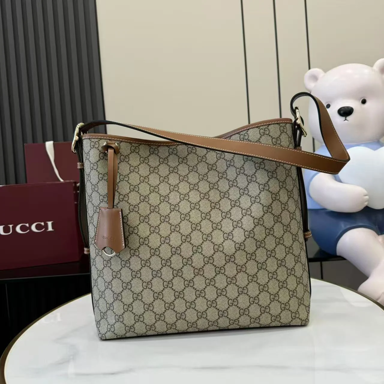 1-1475 Gucci GG Emblem Bucket Bag 847452 - Image 1